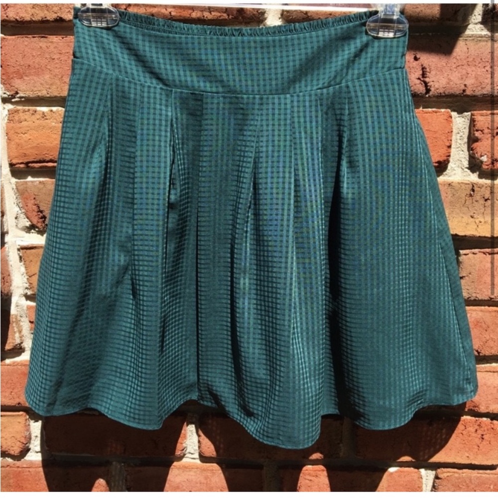 Green pleated skirt